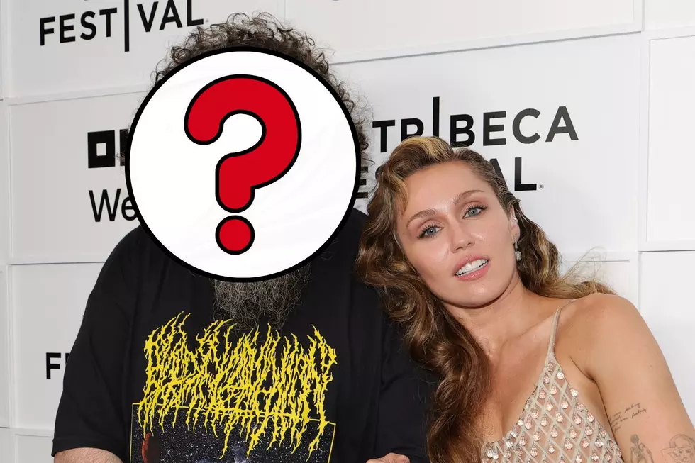 Man in Death Metal Shirt Takes Red Carpet Photo With Miley Cyrus